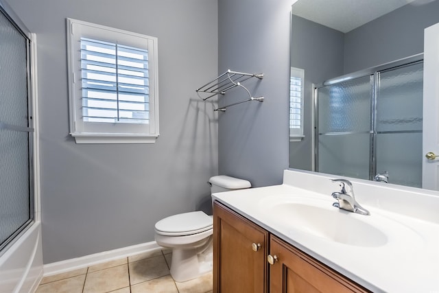 full bathroom with tile patterned flooring, vanity, toilet, and enclosed tub / shower combo