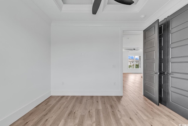 unfurnished room with ceiling fan, light wood finished floors, and baseboards