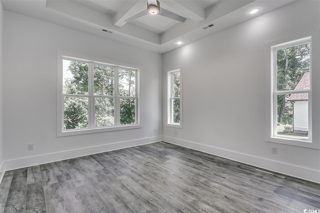 spare room with hardwood / wood-style flooring and ceiling fan