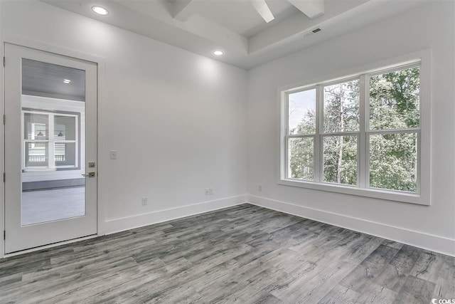 empty room with hardwood / wood-style flooring