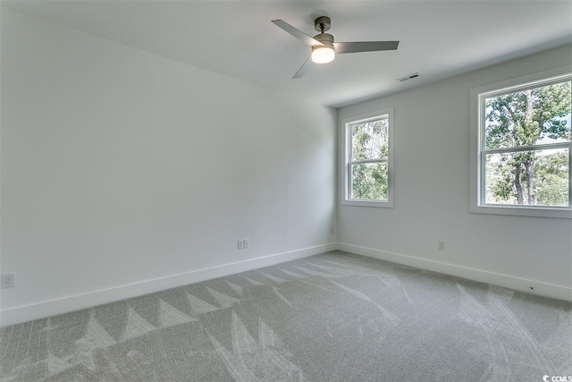 unfurnished room with light carpet and ceiling fan