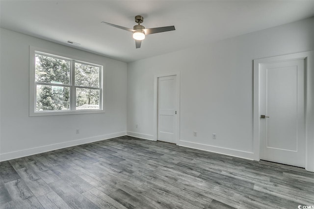 empty room with light hardwood / wood-style flooring and ceiling fan