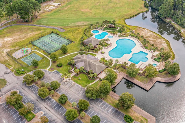 birds eye view of property with a water view