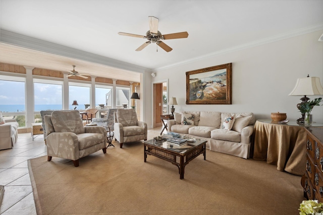 living room featuring light tile patterned floors, ornamental molding, a water view, and a ceiling fan