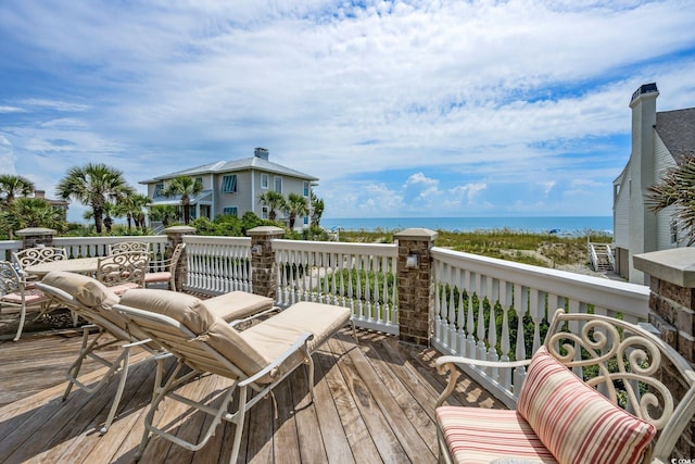 wooden terrace with a water view