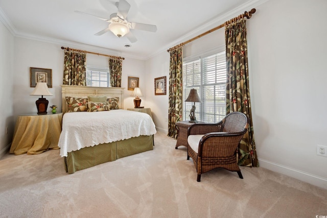 bedroom featuring ornamental molding, a ceiling fan, light colored carpet, and baseboards