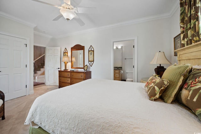 bedroom with light carpet, ceiling fan, connected bathroom, and crown molding