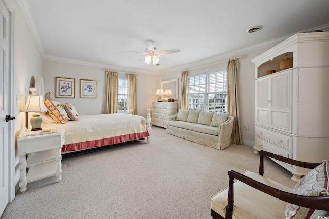 carpeted bedroom featuring ornamental molding, multiple windows, ceiling fan, and visible vents