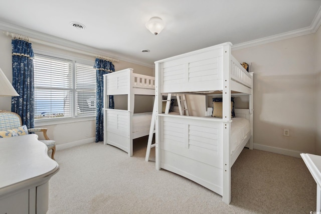 bedroom featuring baseboards, visible vents, crown molding, and light colored carpet