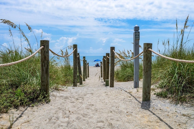 view of gate featuring a water view