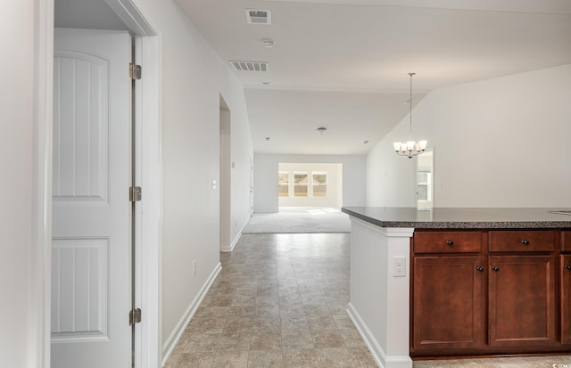 357 Cardita Loop, Myrtle Beach, SC 29588 - corridor featuring baseboards, a chandelier, and stone finish flooring