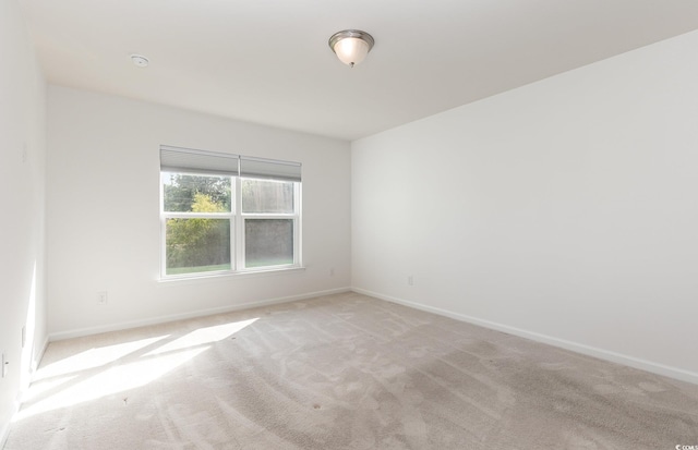 empty room with light colored carpet