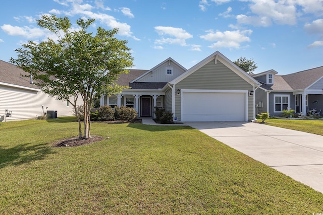 view of front of house with a garage and a front yard