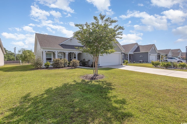 view of front facade with covered porch, a garage, and a front lawn