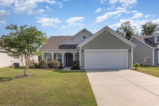 357 Cardita Loop, Myrtle Beach, SC 29588 - craftsman-style home featuring a garage, board and batten siding, driveway, a front lawn, and central air condition unit