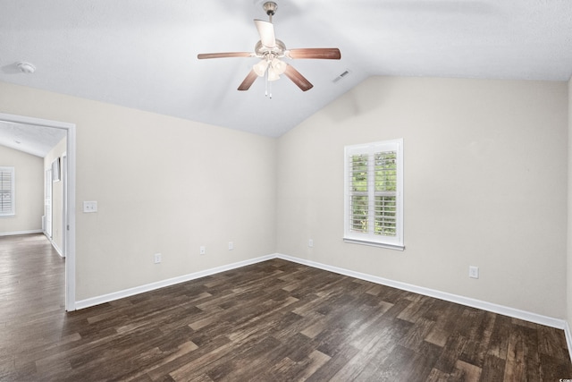 spare room featuring ceiling fan, dark hardwood / wood-style flooring, and lofted ceiling