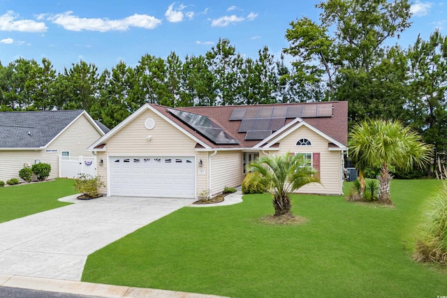 view of front of house featuring a front lawn, a garage, and solar panels