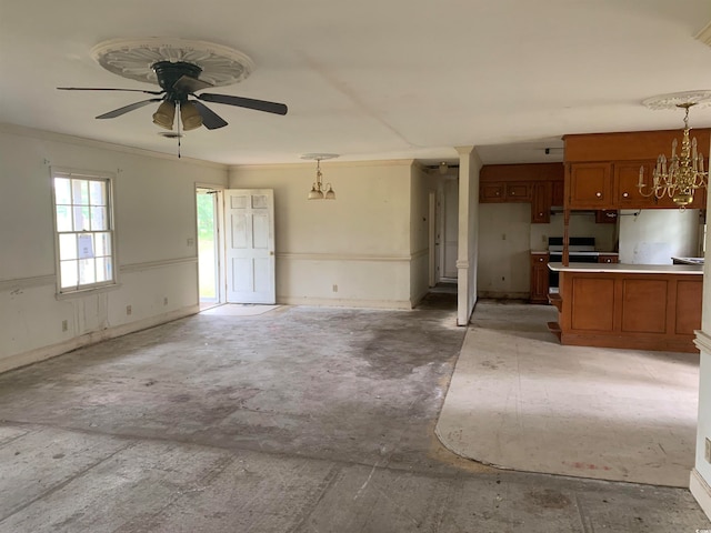 kitchen featuring crown molding, kitchen peninsula, ceiling fan with notable chandelier, and decorative light fixtures