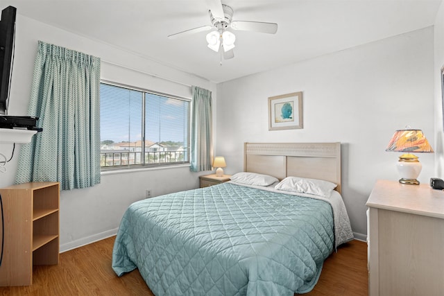 bedroom featuring ceiling fan and light hardwood / wood-style flooring