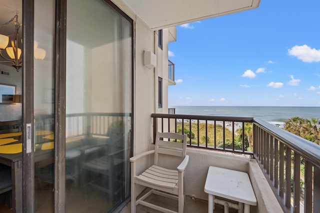 balcony featuring a water view