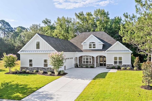 view of front of house featuring a garage and a front yard