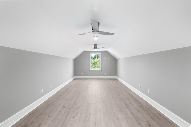 bonus room with ceiling fan, light hardwood / wood-style flooring, and lofted ceiling