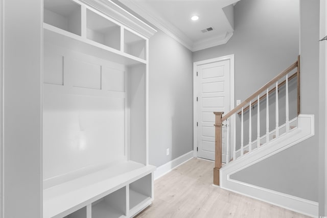 mudroom with crown molding and light wood-type flooring