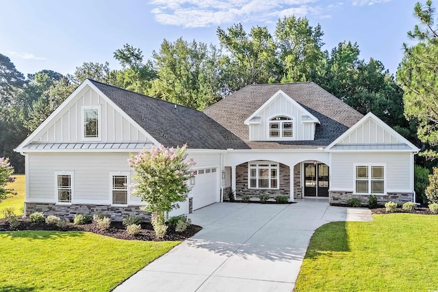 view of front facade with a front yard and a garage