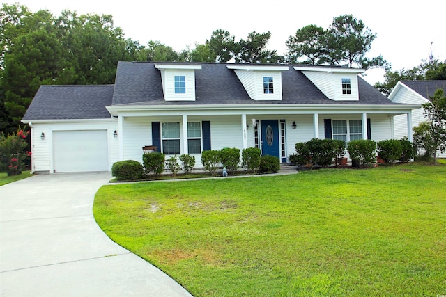 cape cod home featuring a garage, a front yard, and covered porch