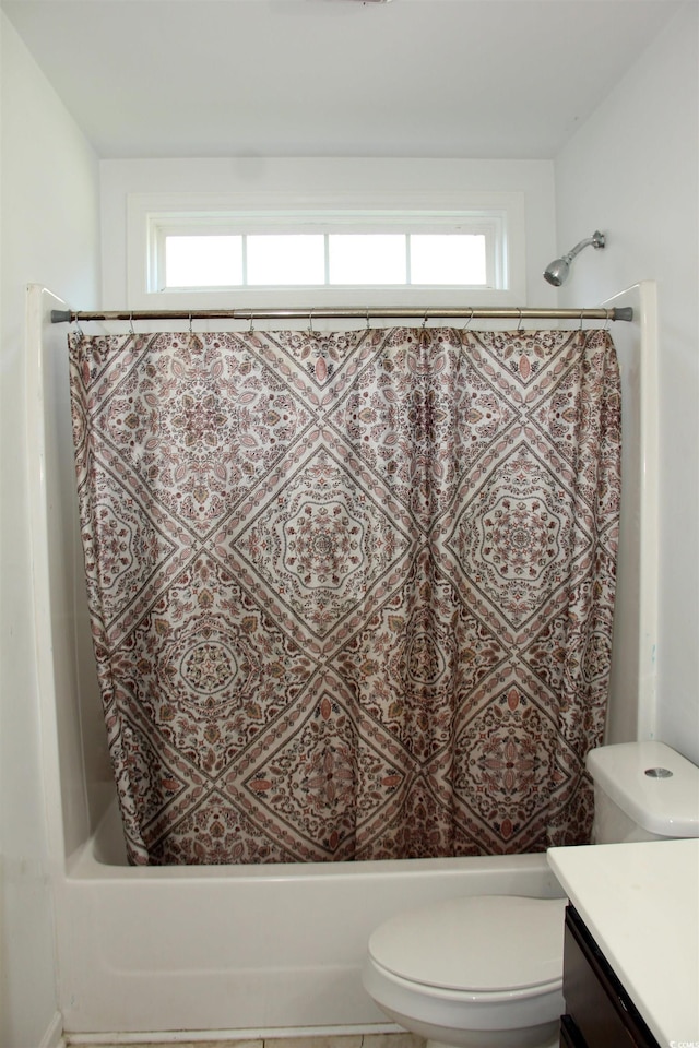 full bathroom with vanity, plenty of natural light, shower / bath combo, and toilet