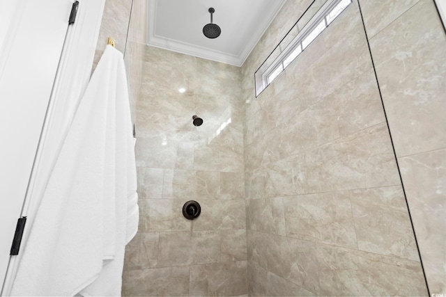 interior details featuring a shower with shower curtain and crown molding