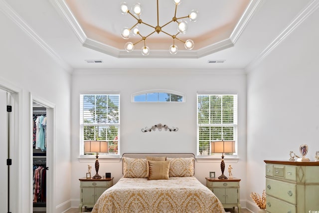 bedroom with ornamental molding, a closet, and multiple windows