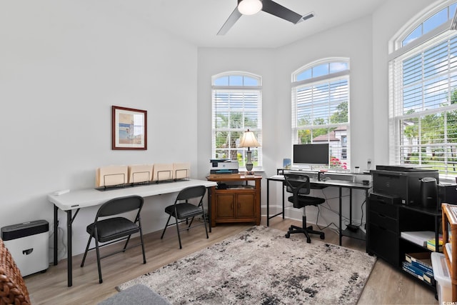 office featuring light wood-type flooring and ceiling fan