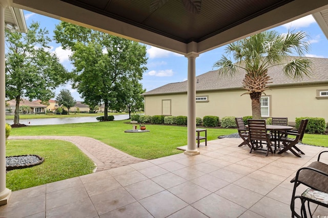 view of patio with a water view