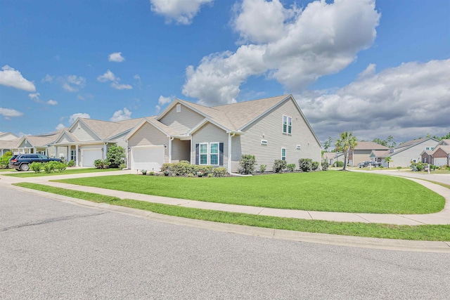 view of front facade with a garage and a front yard