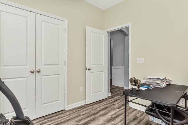 bedroom featuring dark wood-type flooring