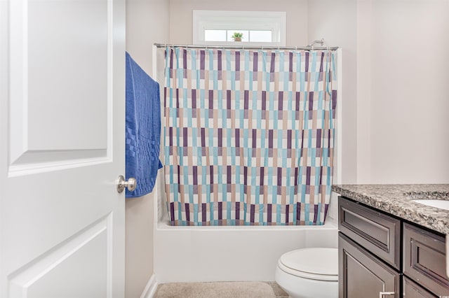 full bathroom featuring shower / tub combo with curtain, toilet, and vanity