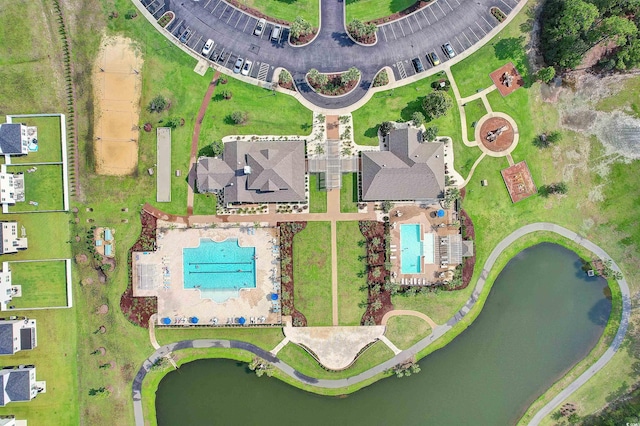 birds eye view of property featuring a water view