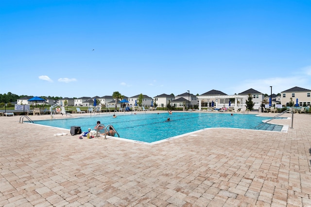 view of pool featuring a patio