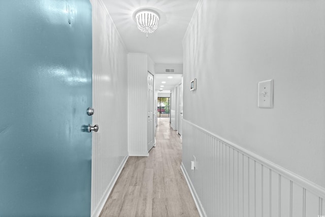 corridor with light hardwood / wood-style flooring