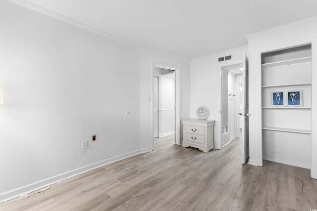 unfurnished bedroom featuring light hardwood / wood-style floors and ornamental molding