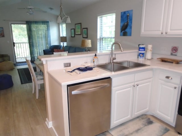 kitchen featuring dishwasher, kitchen peninsula, and white cabinetry