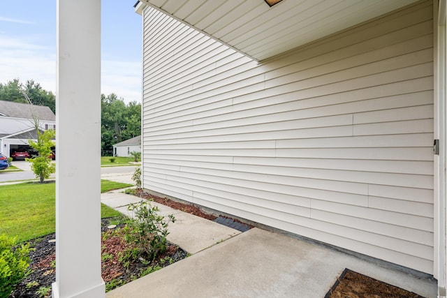 view of side of property with a yard