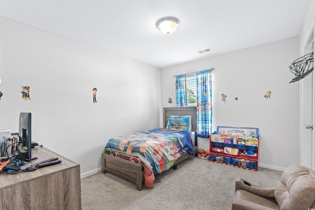 bedroom with carpet flooring, baseboards, and visible vents