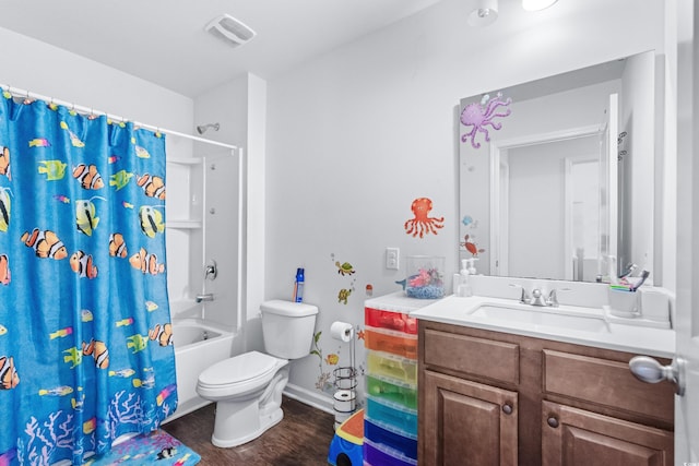 full bath featuring visible vents, toilet, wood finished floors, vanity, and shower / tub combo