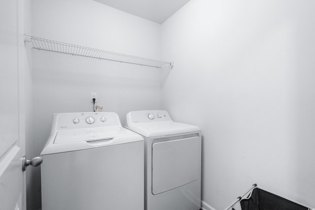 laundry room featuring washing machine and clothes dryer and laundry area