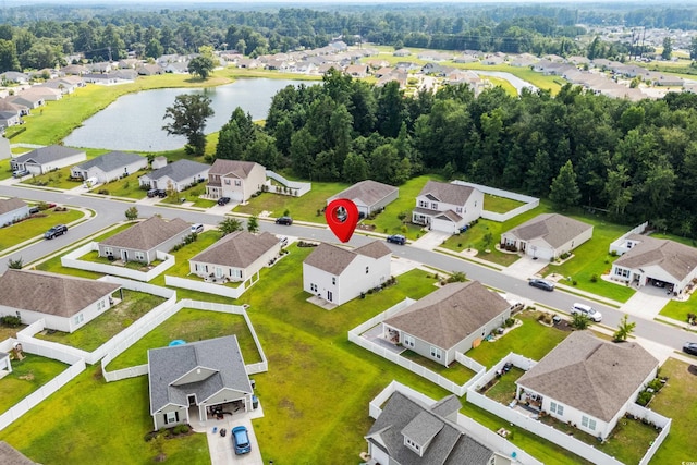 drone / aerial view with a residential view and a water view
