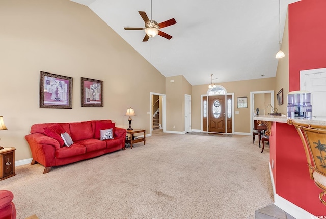 carpeted living room featuring high vaulted ceiling and ceiling fan