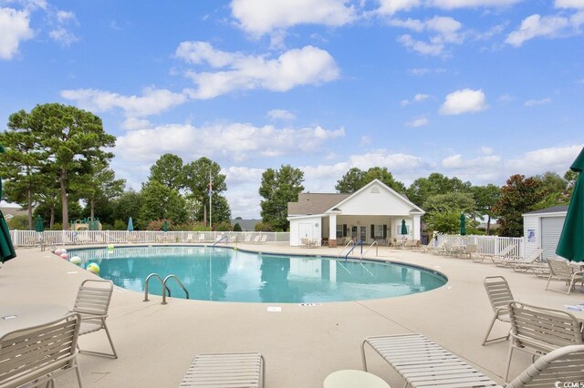 view of swimming pool featuring a patio