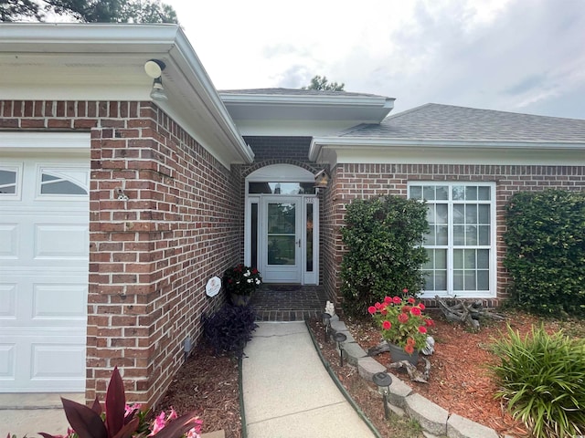 property entrance with a garage